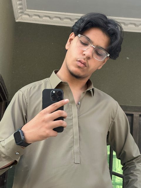 Moaaz Ali in an olive shalwar kameez